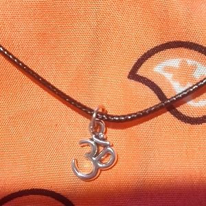 Black cord necklace with ohm charm